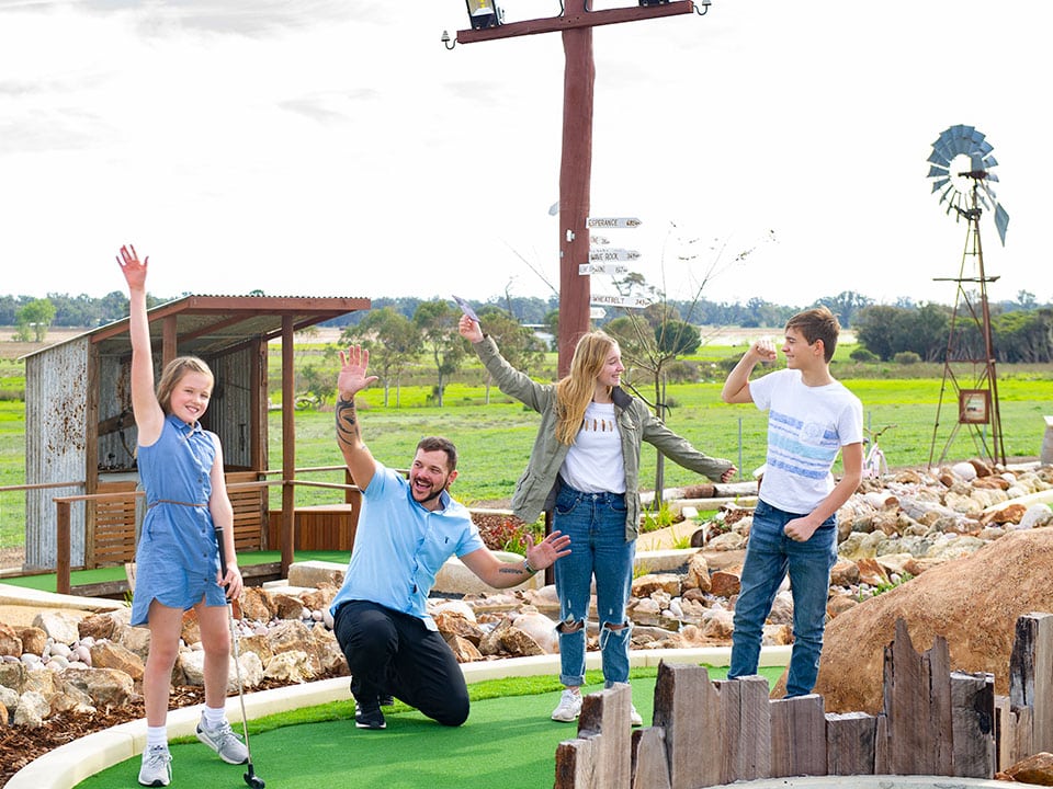 Family enjoying golf activities near Mandurah at Old Coast Road Brewery