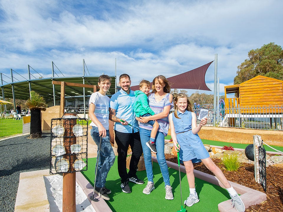 Kids and parents playing golf activities at Old Coast Road Brewery