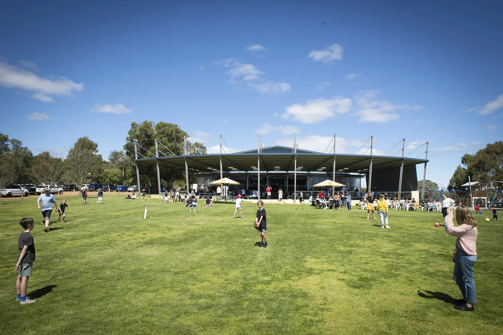 Families enjoying the wide lawns outside Old Coast Road Brewery