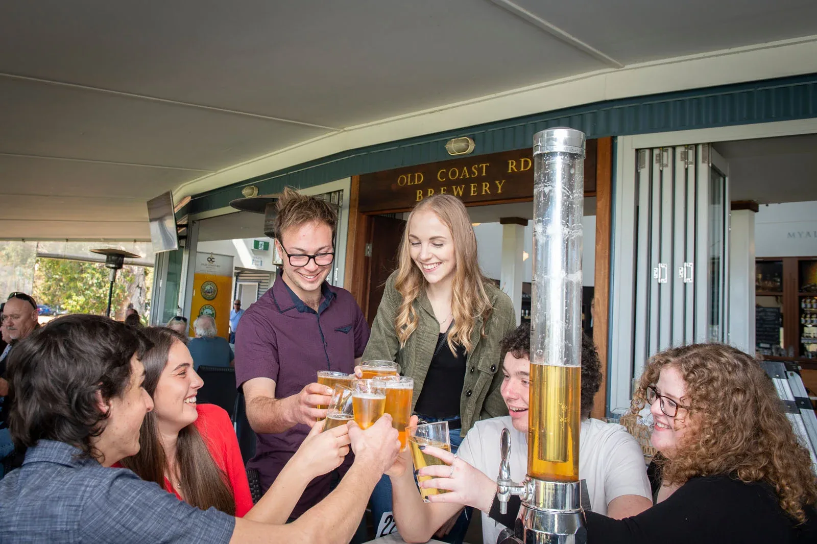Friends sharing a drink at Old Coast Road Brewery